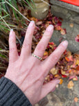 18CT GOLD STRIKE WITH 7 BLACK DIAMONDS RING