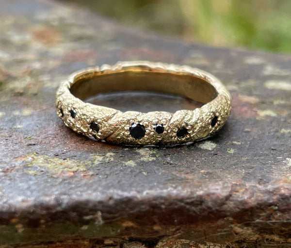 18CT GOLD STRIKE WITH 7 BLACK DIAMONDS RING
